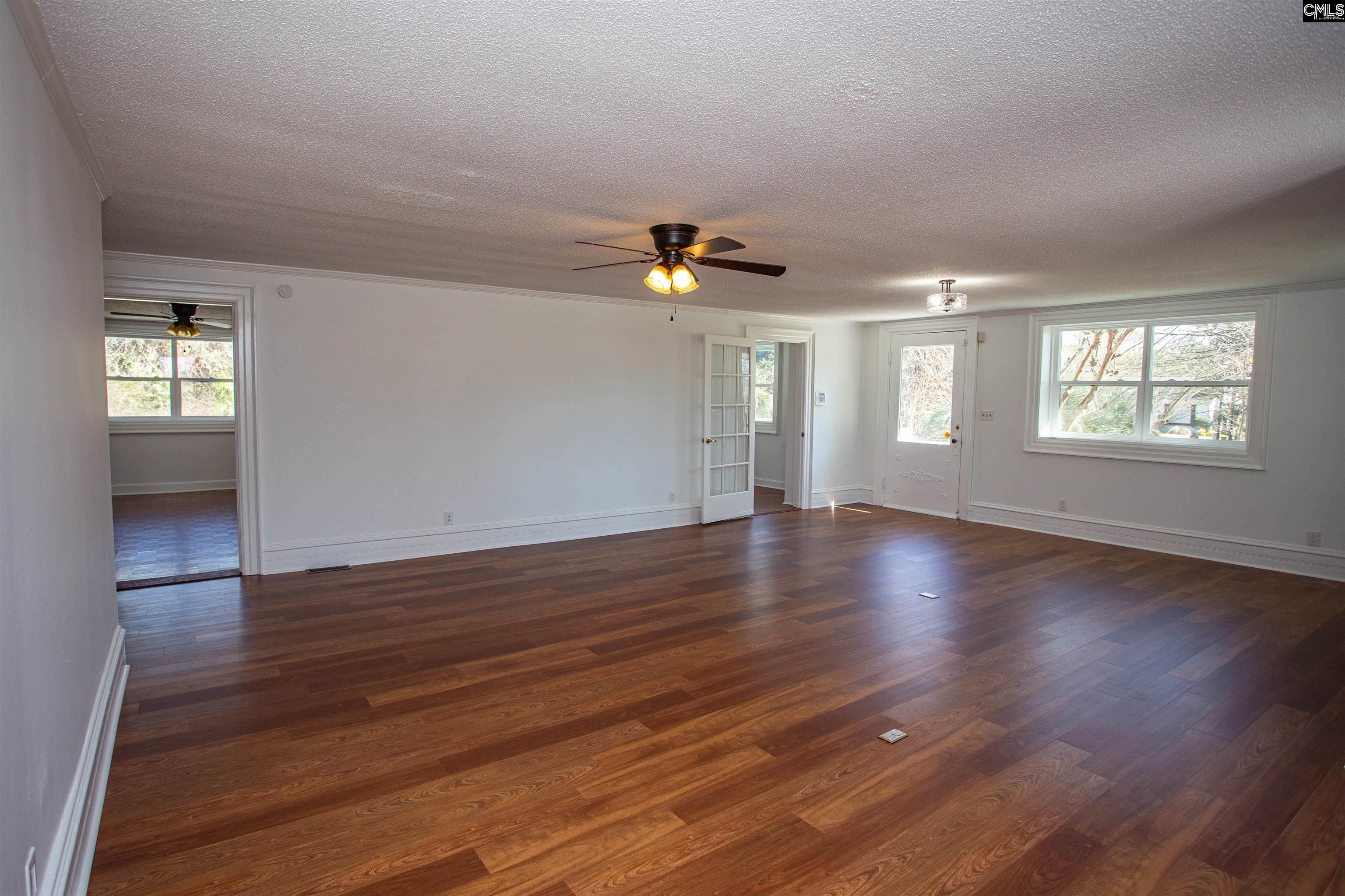 1700 Broad Street Camden, SC 29020 - Photo 4 of 41 an empty room with wooden floor and windows
