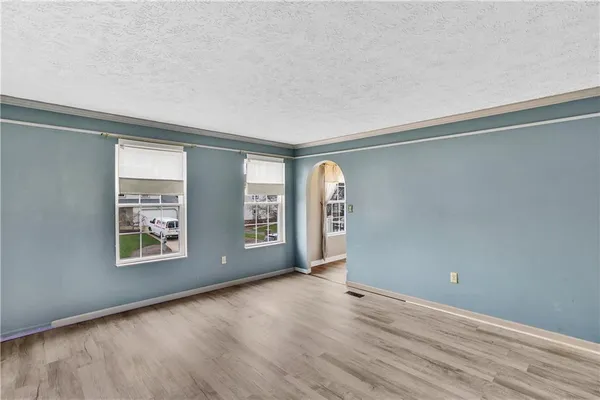 an empty room with windows