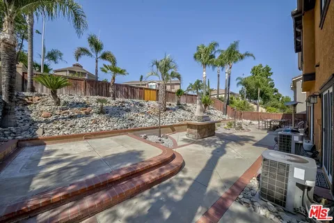 a swimming pool with outdoor seating