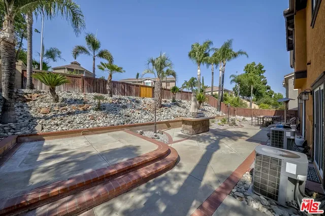 a swimming pool with outdoor seating