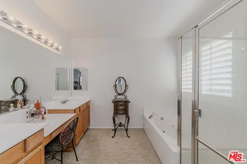 a room with a table chairs and a chandelier