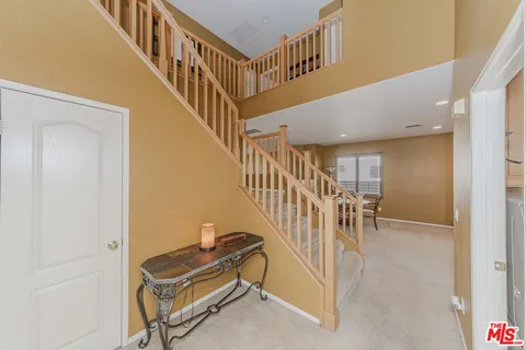 a view of entryway and hall with dining room