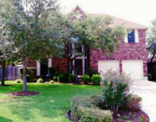 10712 Redmond Road Austin, TX 78739 - Photo 1 of 1 a front view of a house with garden