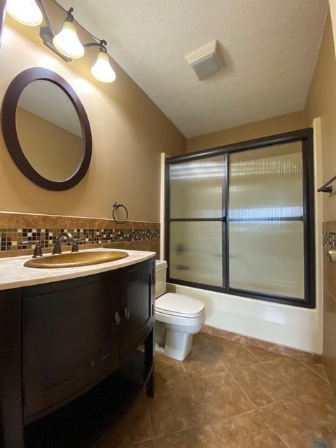 11426 East Radisson Road Mount Vernon, IL 62864 - Photo 16 of 56 a bathroom with a sink mirror vanity and a toilet