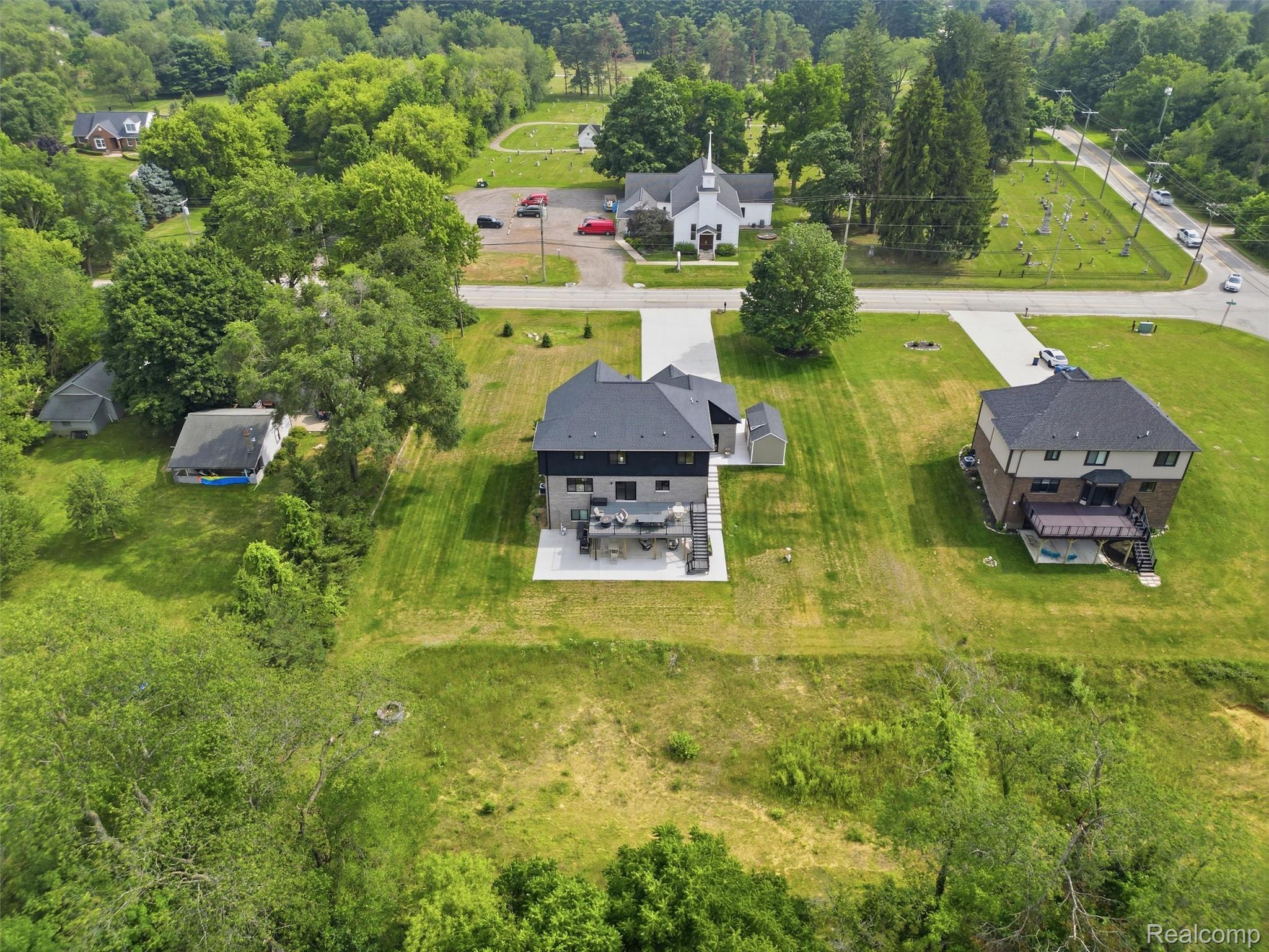 3007 28 Mile Road Washington, MI 48094 - Photo 63 of 69 Modern residential property featuring a multi-level design and a dark gray roof