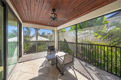 a view of an house with swimming pool and porch