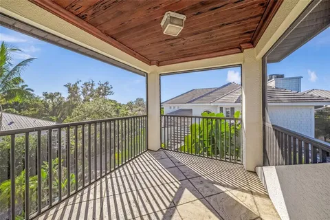 a view of a house with backyard porch and sitting area