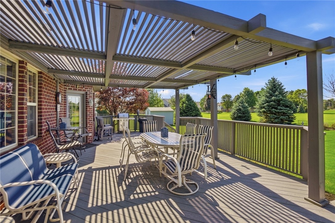 710 Governors Road Troy, OH 45373 - Photo 48 of 56 This spacious outdoor deck features a slatted pergola, perfect for relaxation and outdoor gatherings.