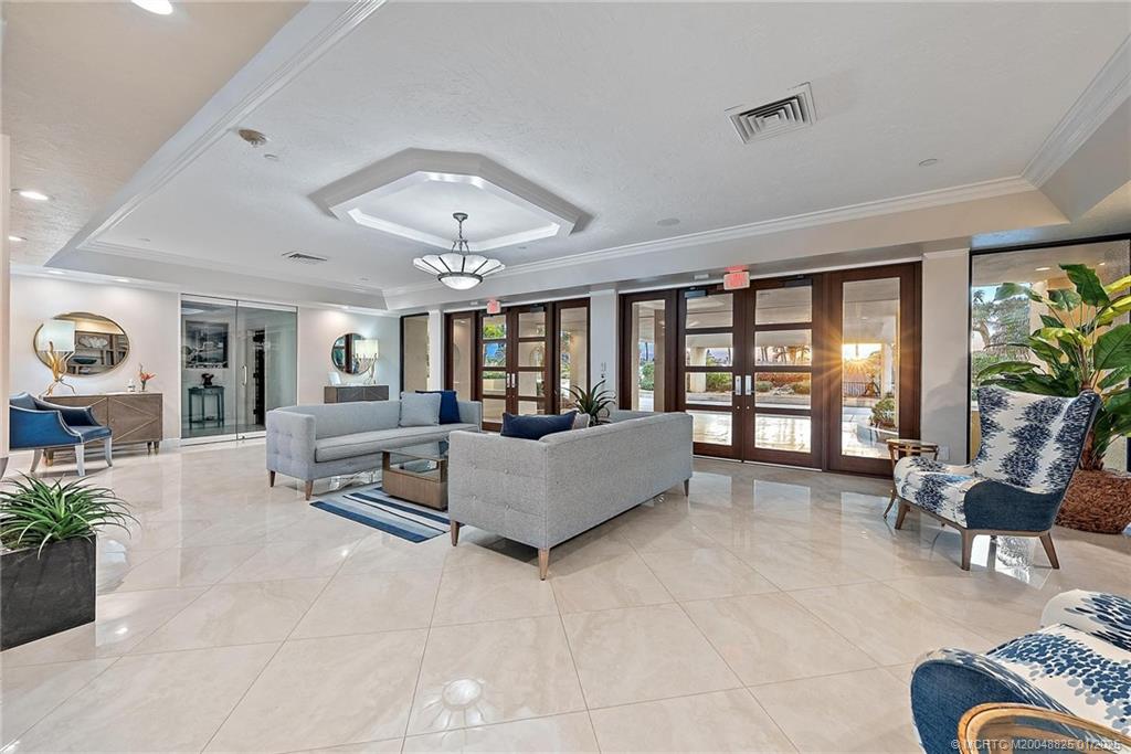 8750 South Ocean Drive, Unit 1435 Jensen Beach, FL 34957 - Photo 30 of 38 a living room with furniture and a large window