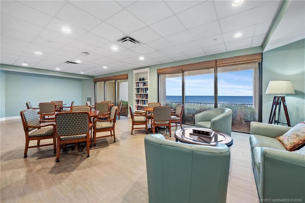 8750 South Ocean Drive, Unit 1435 Jensen Beach, FL 34957 - Photo 33 of 38 a living room with furniture and a large window