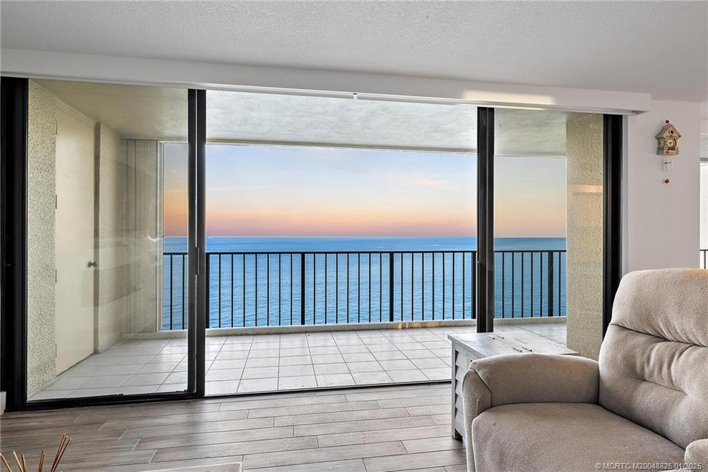 8750 South Ocean Drive, Unit 1435 Jensen Beach, FL 34957 - Photo 5 of 38 a living room with furniture and a window