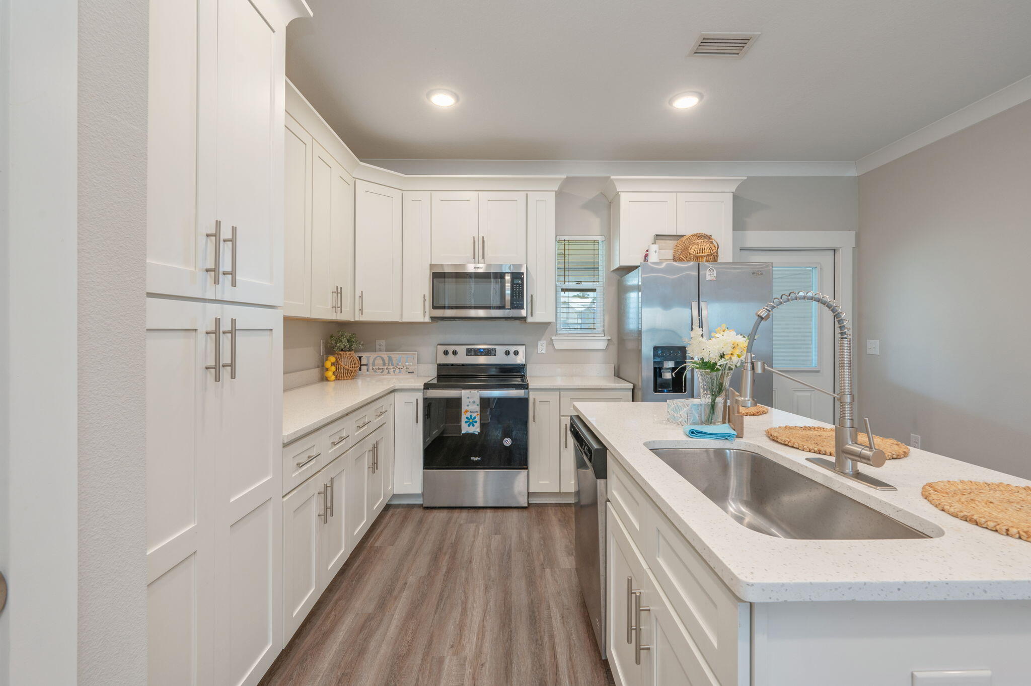 275 North Sand Palm Road, Unit 167VISTA Freeport, FL 32439 - Photo 13 of 40 a kitchen with stainless steel appliances granite countertop a sink stove and refrigerator