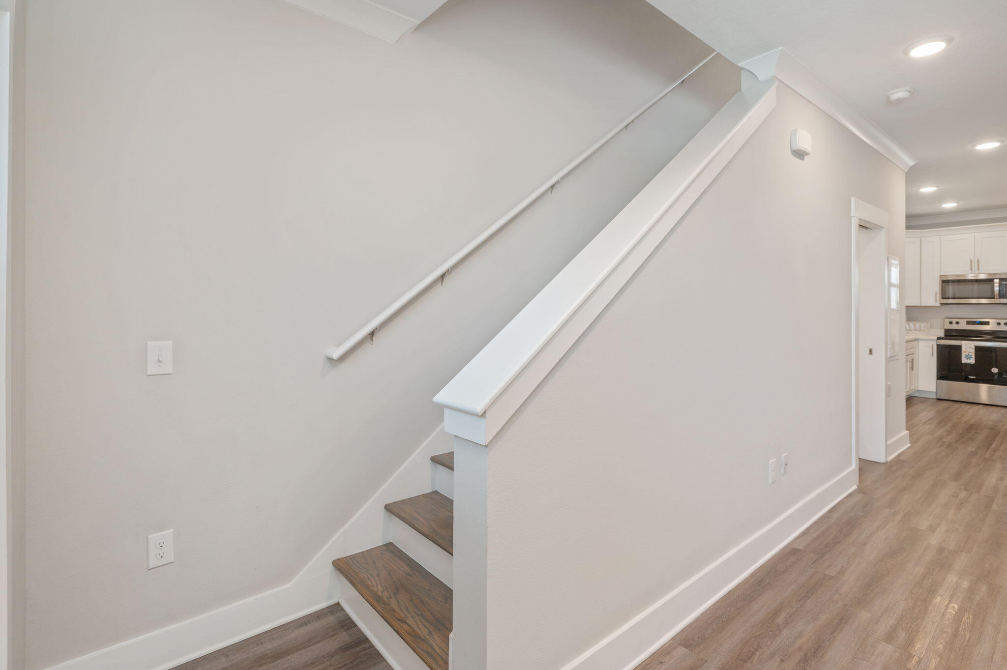 275 North Sand Palm Road, Unit 167VISTA Freeport, FL 32439 - Photo 16 of 40 a view of a hallway with wooden floor and staircase