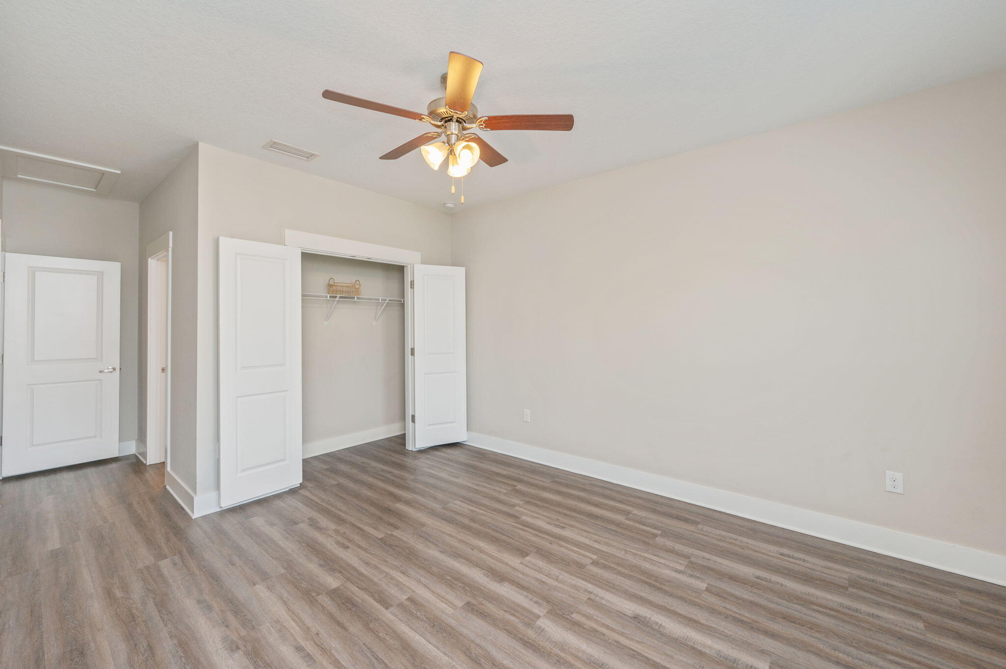 275 North Sand Palm Road, Unit 167VISTA Freeport, FL 32439 - Photo 18 of 40 a view of an empty room with wooden floor