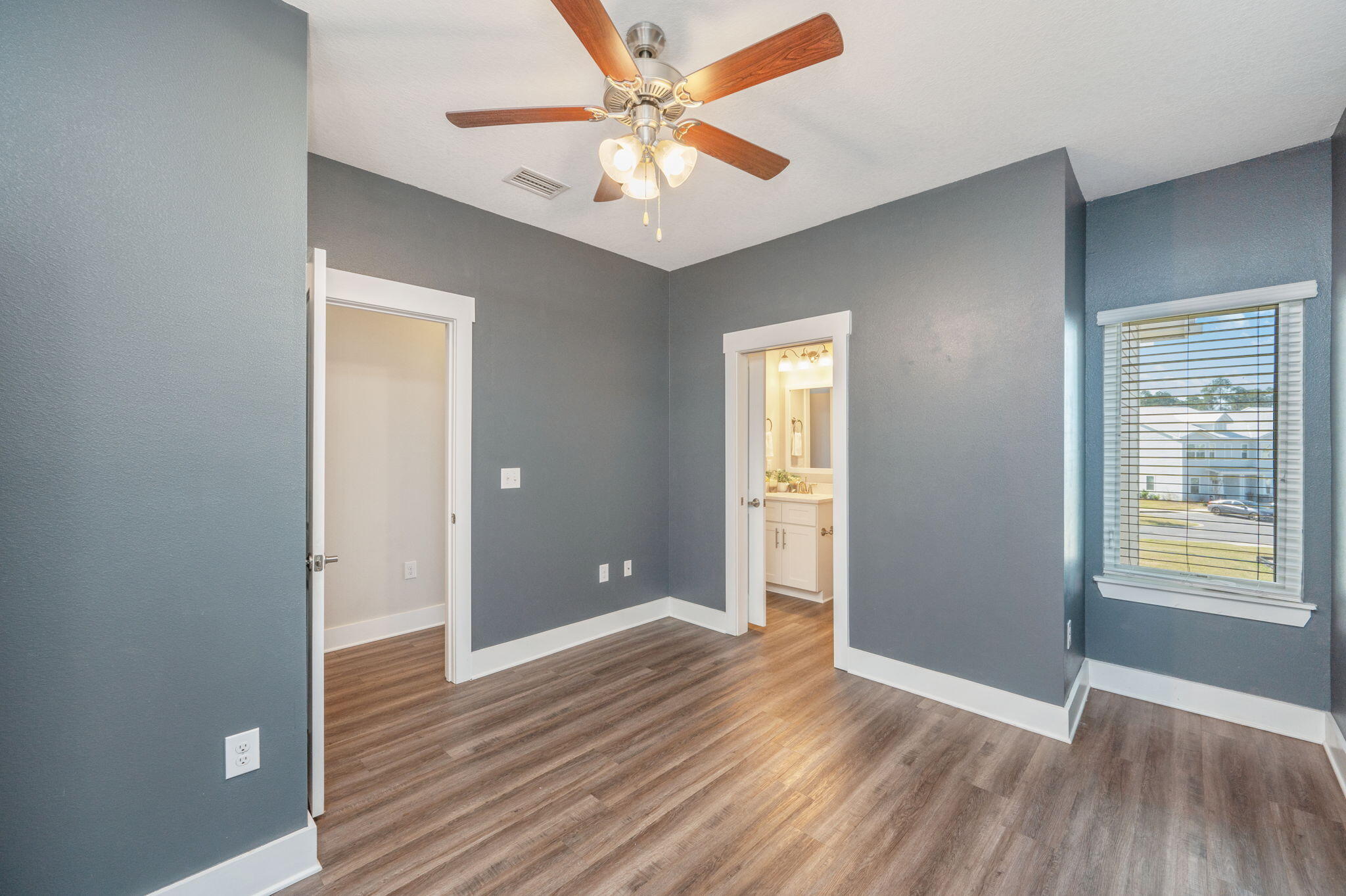 275 North Sand Palm Road, Unit 167VISTA Freeport, FL 32439 - Photo 23 of 40 a view of an empty room with window and wooden floor