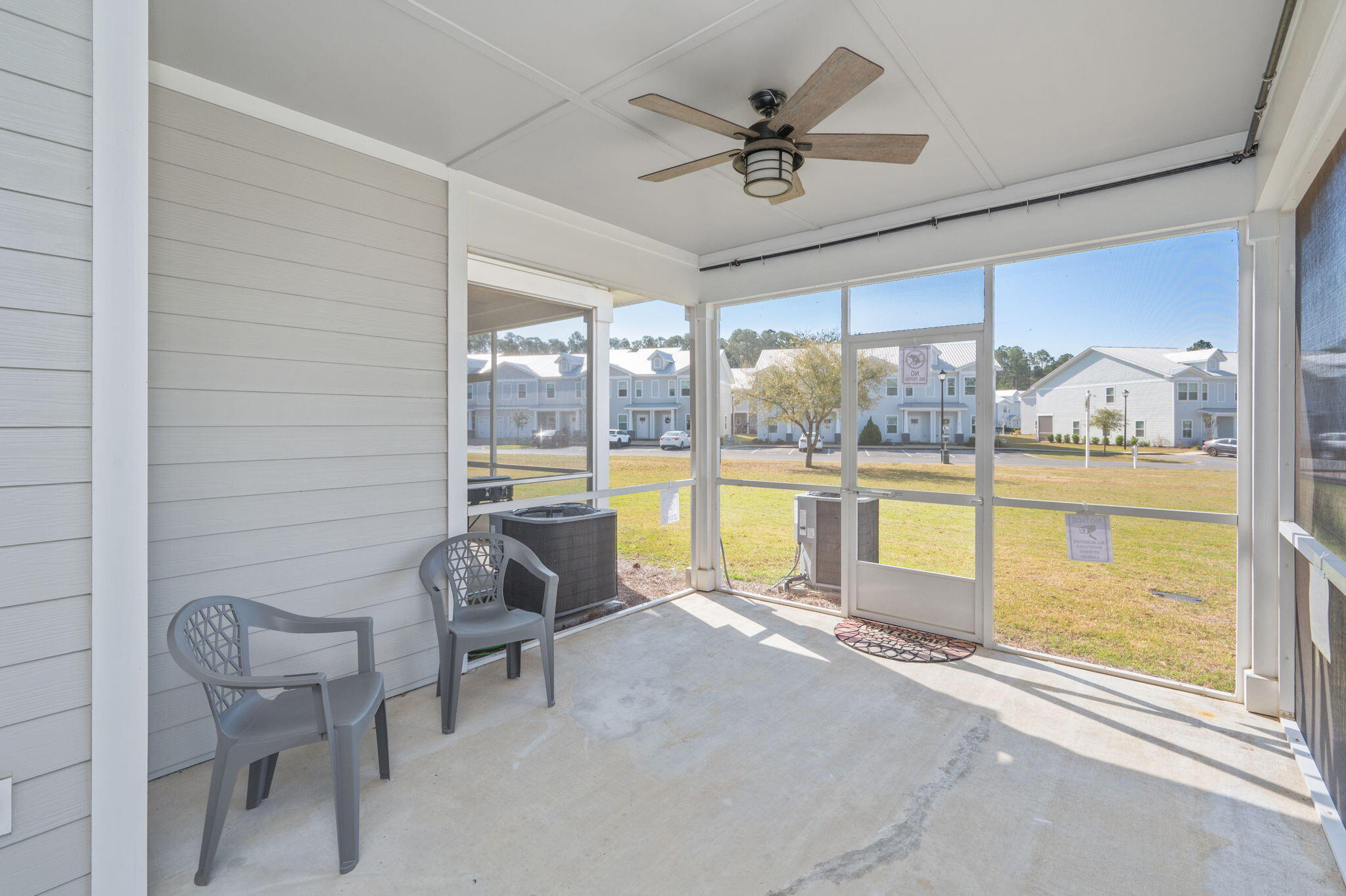 275 North Sand Palm Road, Unit 167VISTA Freeport, FL 32439 - Photo 29 of 40 a living room with a large window and furniture