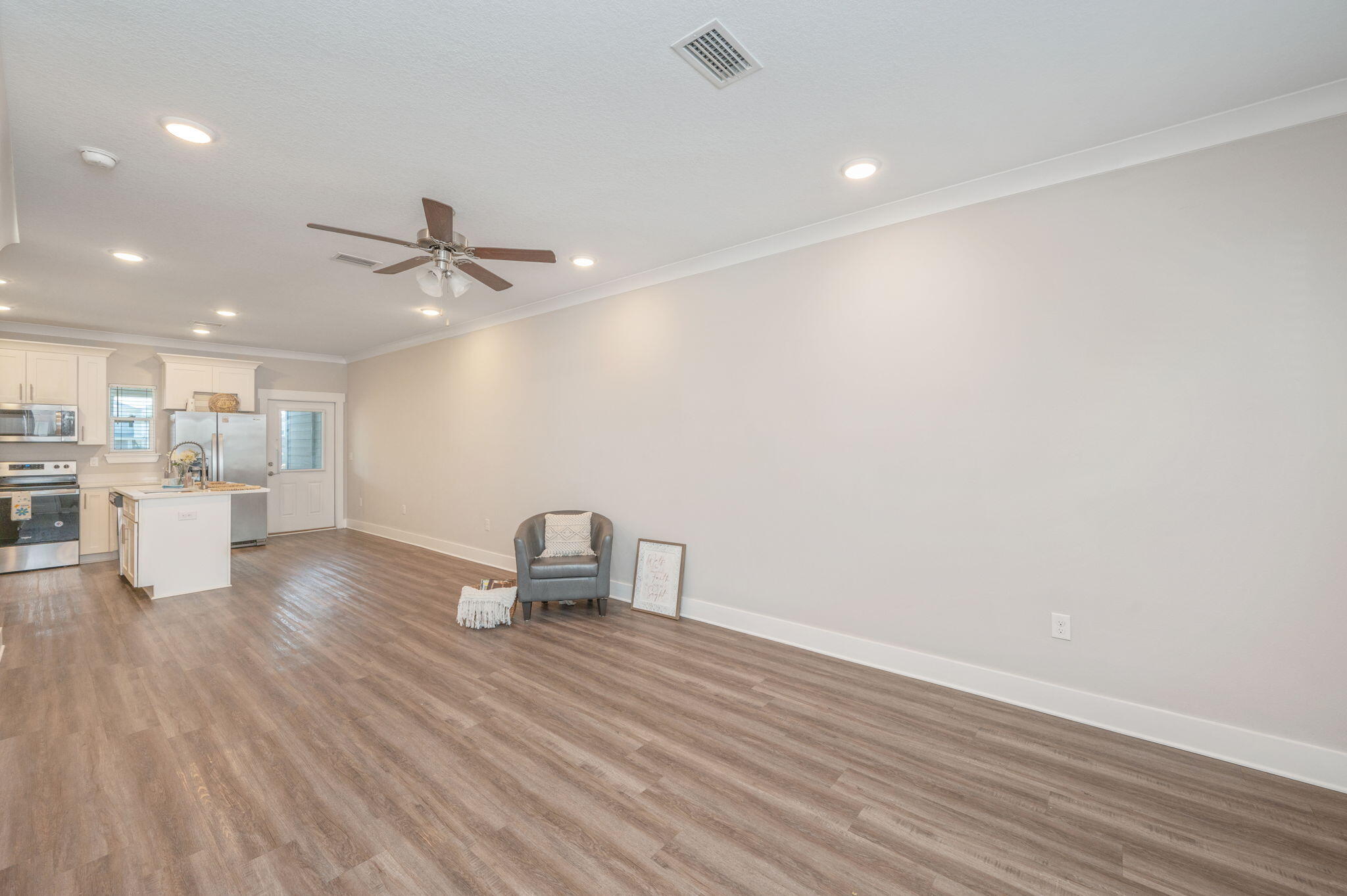 275 North Sand Palm Road, Unit 167VISTA Freeport, FL 32439 - Photo 5 of 40 a view of a work space with wooden floor and a view of kitchen