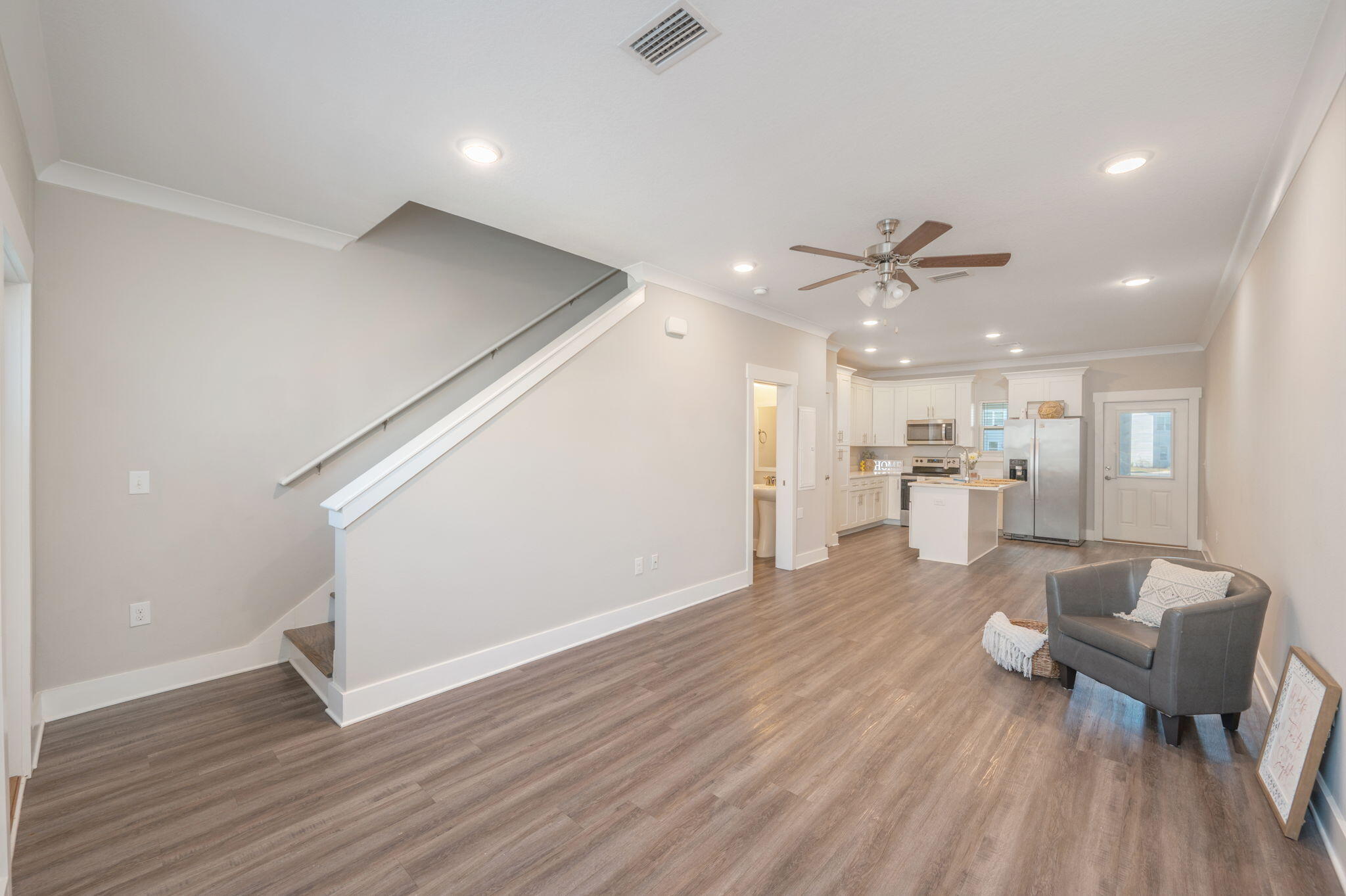 275 North Sand Palm Road, Unit 167VISTA Freeport, FL 32439 - Photo 6 of 40 a living room with furniture and a view of kitchen