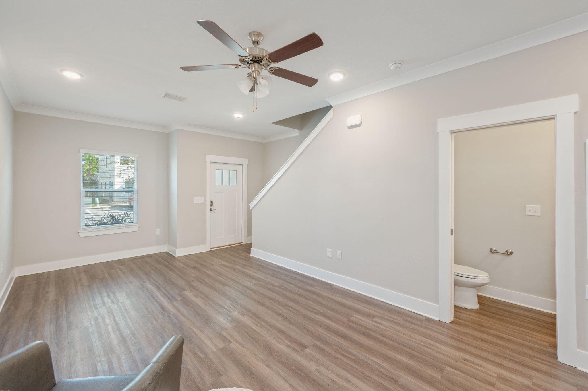 275 North Sand Palm Road, Unit 167VISTA Freeport, FL 32439 - Photo 7 of 40 wooden floor in an empty room with a window