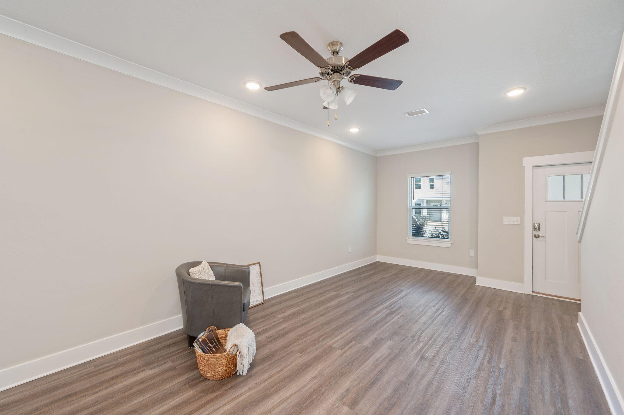 275 North Sand Palm Road, Unit 167VISTA Freeport, FL 32439 - Photo 8 of 40 a workspace with wooden floor fan and windows