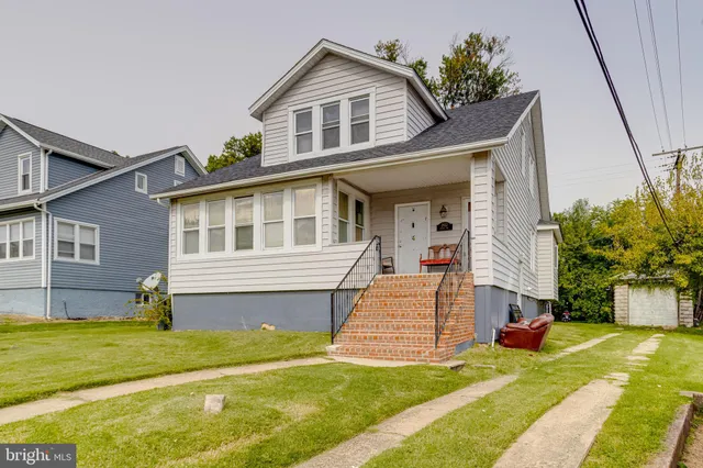 a view of staircase with wooden floor and a window