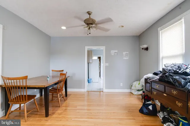 a kitchen with a sink window and cabinets