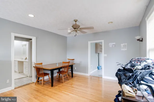 a view of a kitchen with refrigerator and cabinet