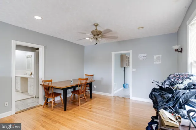 a kitchen with white cabinets sink and appliances