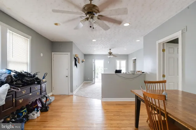 a kitchen with stainless steel appliances granite countertop a sink a stove and cabinets