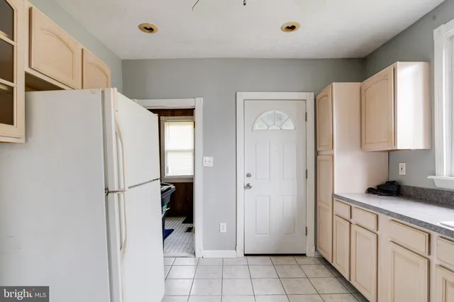 a bedroom with bed and a window