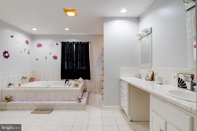 a room with lots of books and a mirror