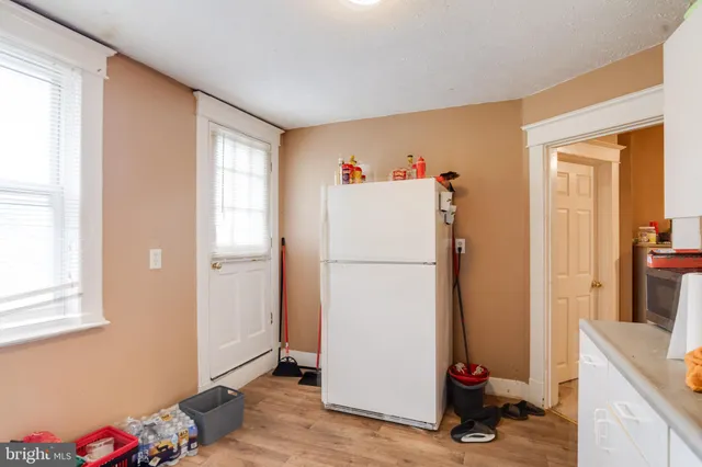 a bathroom with a sink mirror and toilet