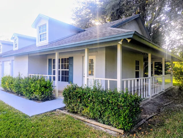 a view of a park with large trees
