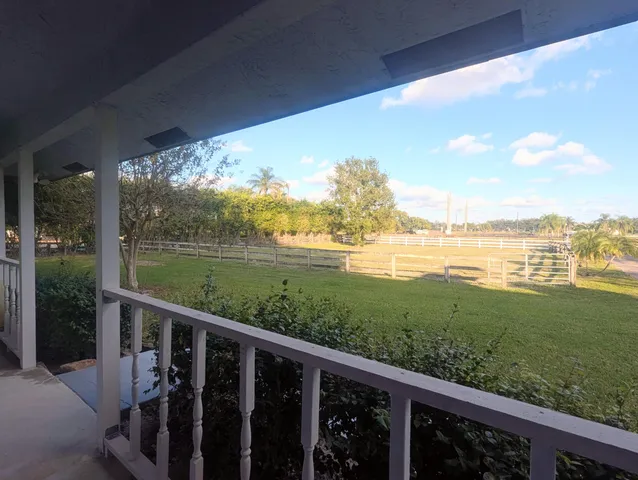 a kitchen with cabinets appliances a window and a counter space
