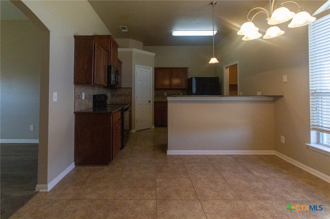217 Pointer Street Nolanville, TX 76559 - Photo 11 of 29 a view of a kitchen with a sink