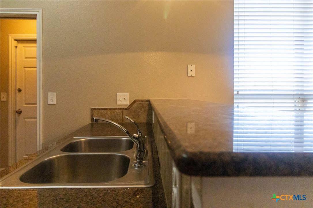 217 Pointer Street Nolanville, TX 76559 - Photo 14 of 29 a bathroom with a sink and a window