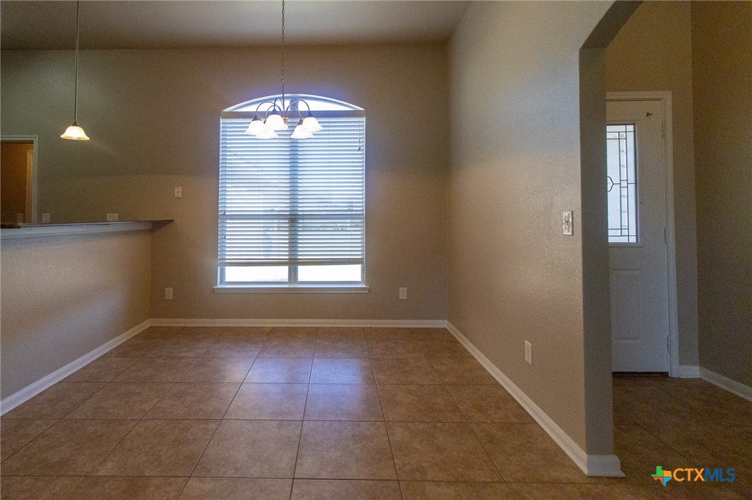 217 Pointer Street Nolanville, TX 76559 - Photo 10 of 29 a view of an empty room with a window