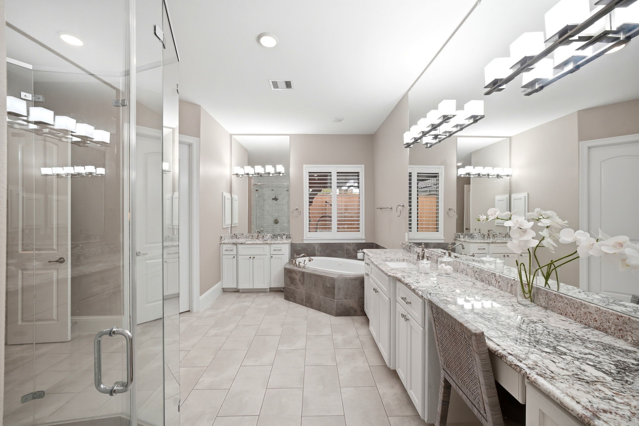 5815 Stratton Woods Drive Spring, TX 77389 - Photo 34 of 45 a large bathroom with a granite countertop sink mirror and shower