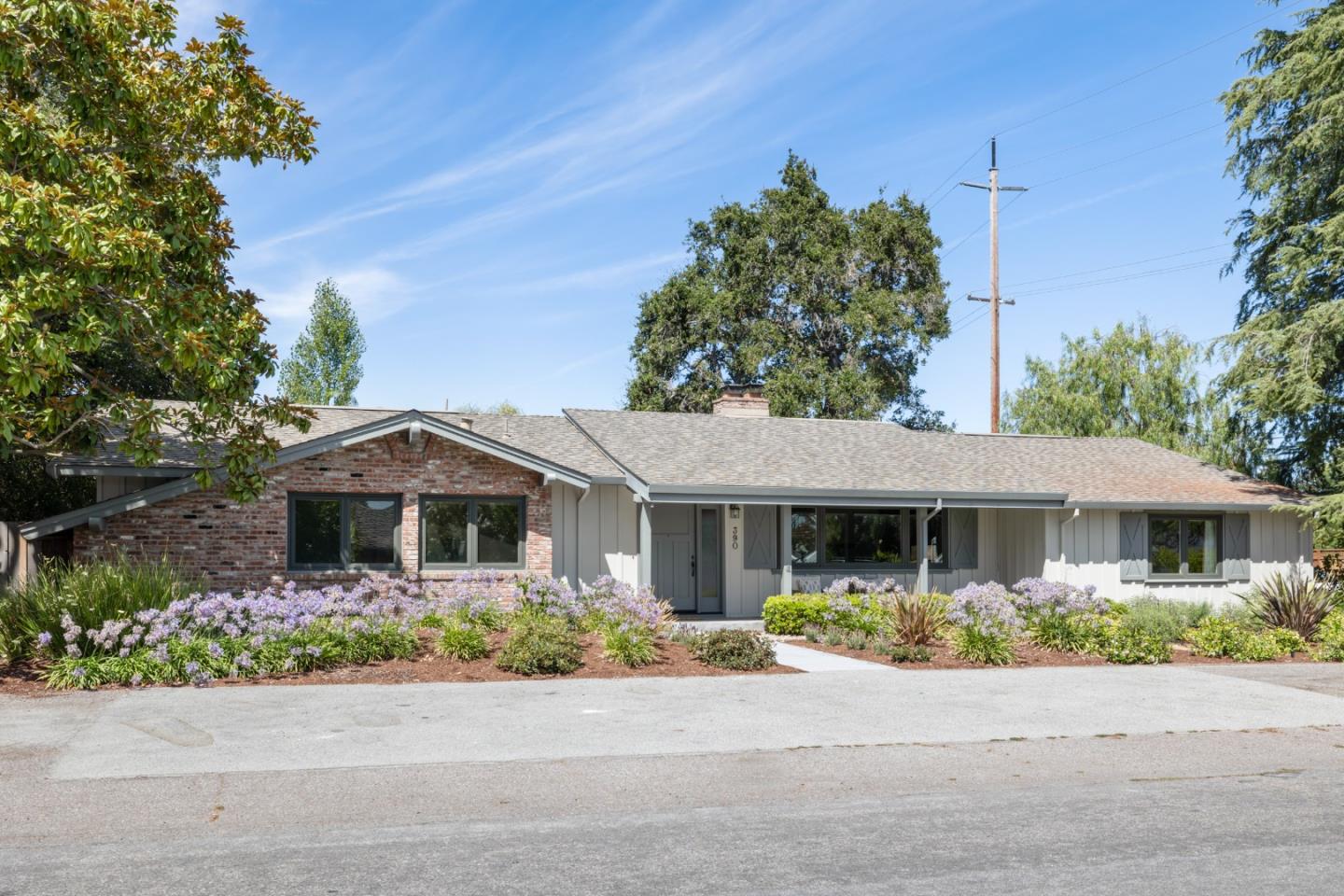 front view of a house with a bench