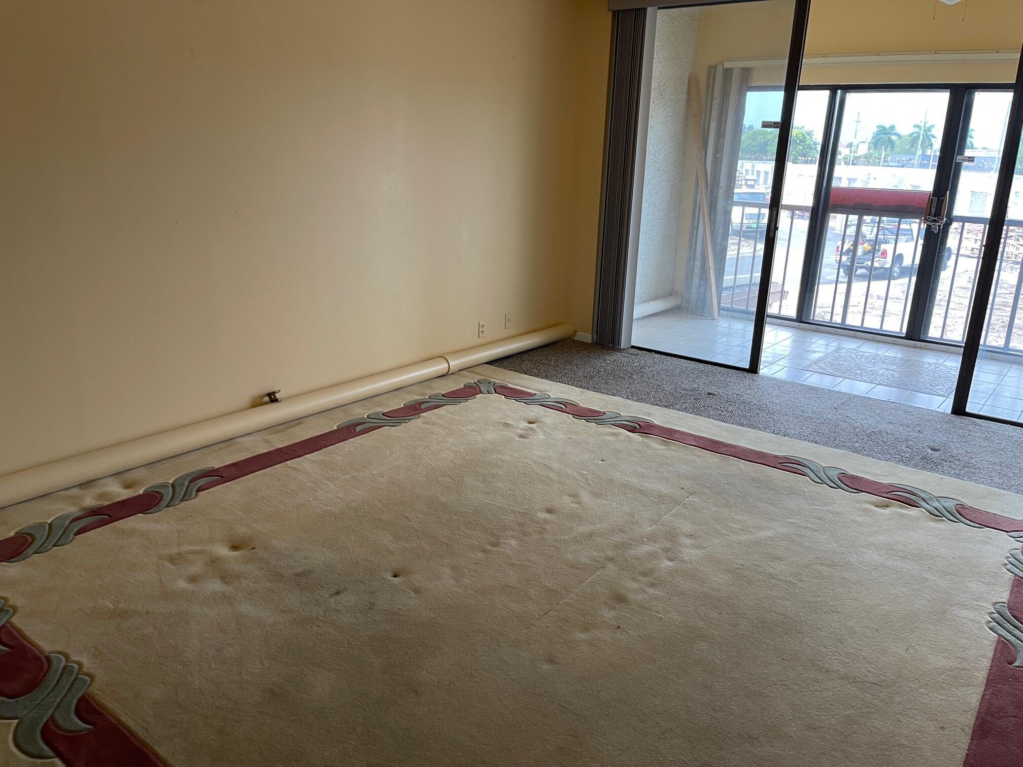 4100 Tivoli Court, Unit 201 Lake Worth, FL 33467 - Photo 4 of 5 a view of an empty room with a window