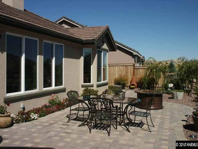 9136 Mount Pleasant Drive Reno, NV 89523 - Photo 8 of 9 a backyard of a house with table and chairs