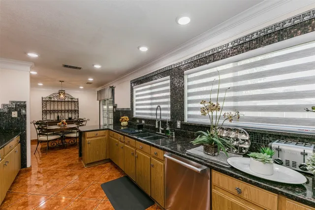 a kitchen with lots of counter top space and living room