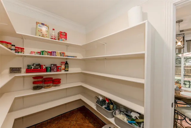 a refrigerator and a wooden floor