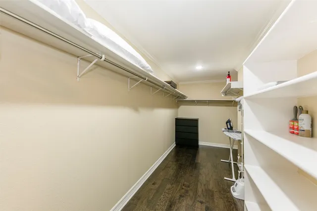 a living room with furniture and a lamp