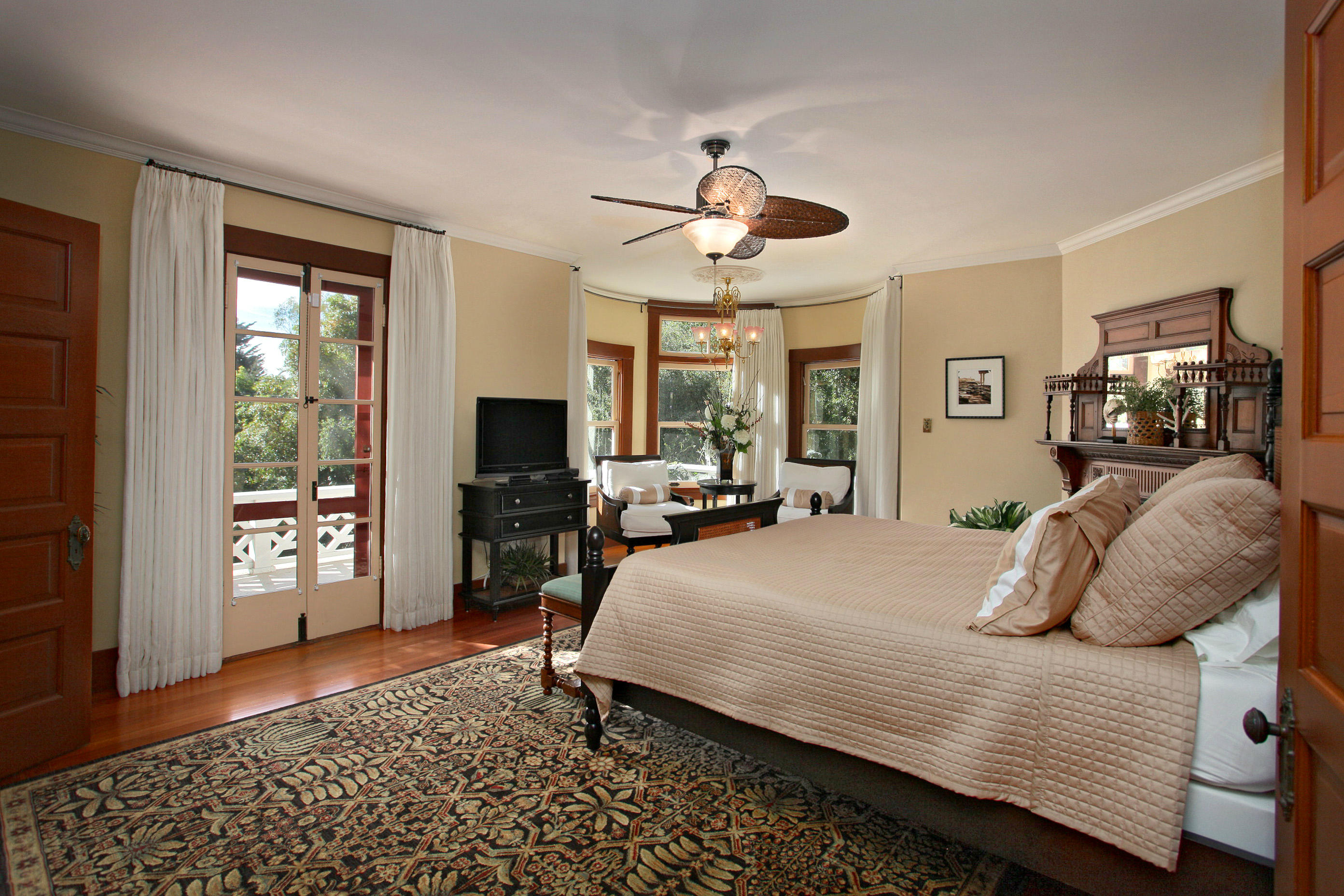 60 Olive Mill Road Santa Barbara, CA 93108 - Photo 11 of 15 a bedroom with a bed and wooden floor