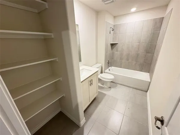 a bathroom with a toilet a sink and a bathtub