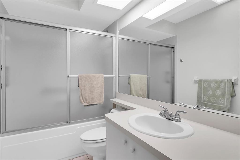 9052 Arundle Place New Port Richey, FL 34655 - Photo 20 of 57 a bathroom with a sink toilet and shower