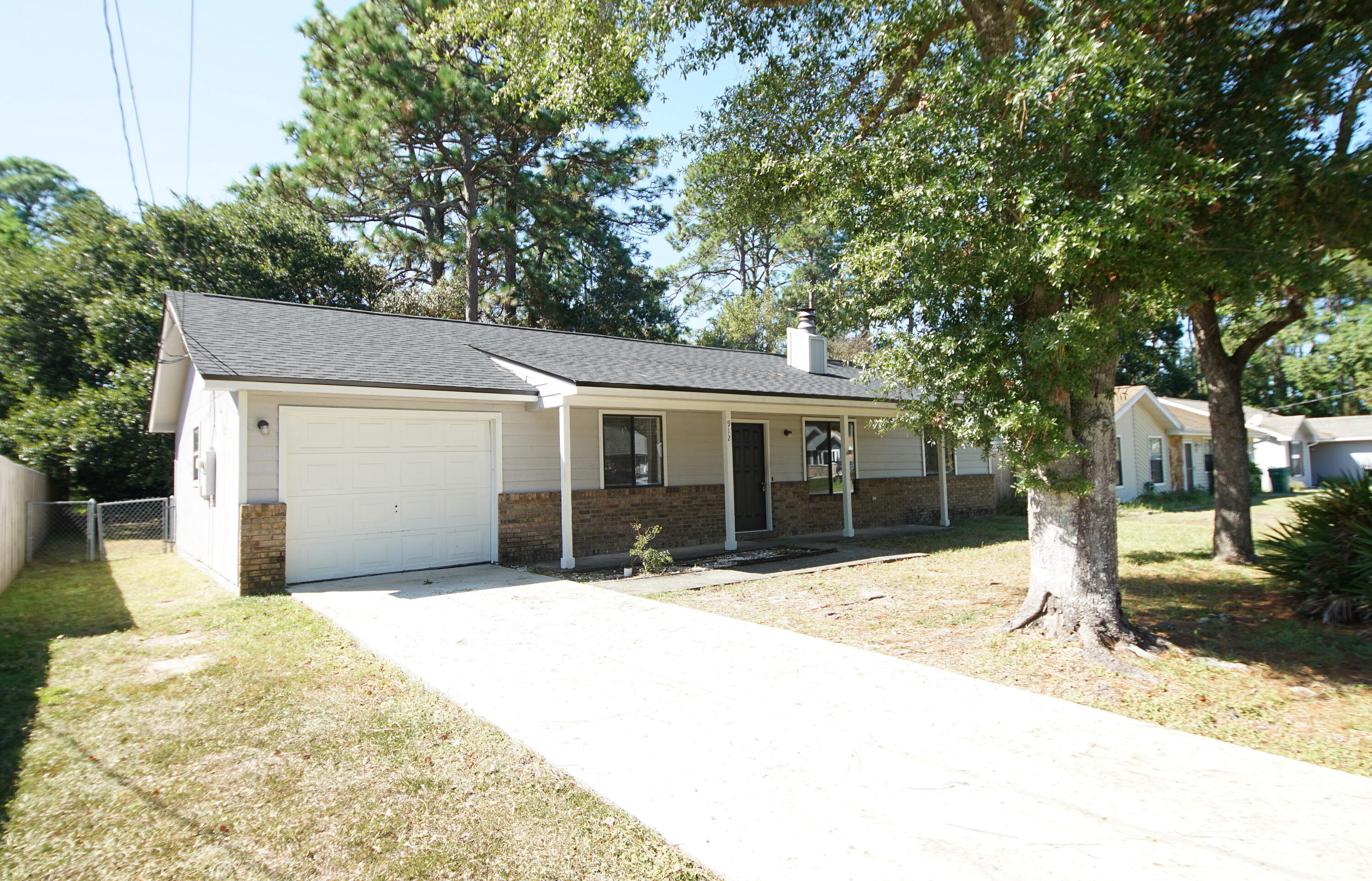 912 Nutmeg Avenue Niceville, FL 32578 - Photo 1 of 30 a front view of a house with a patio