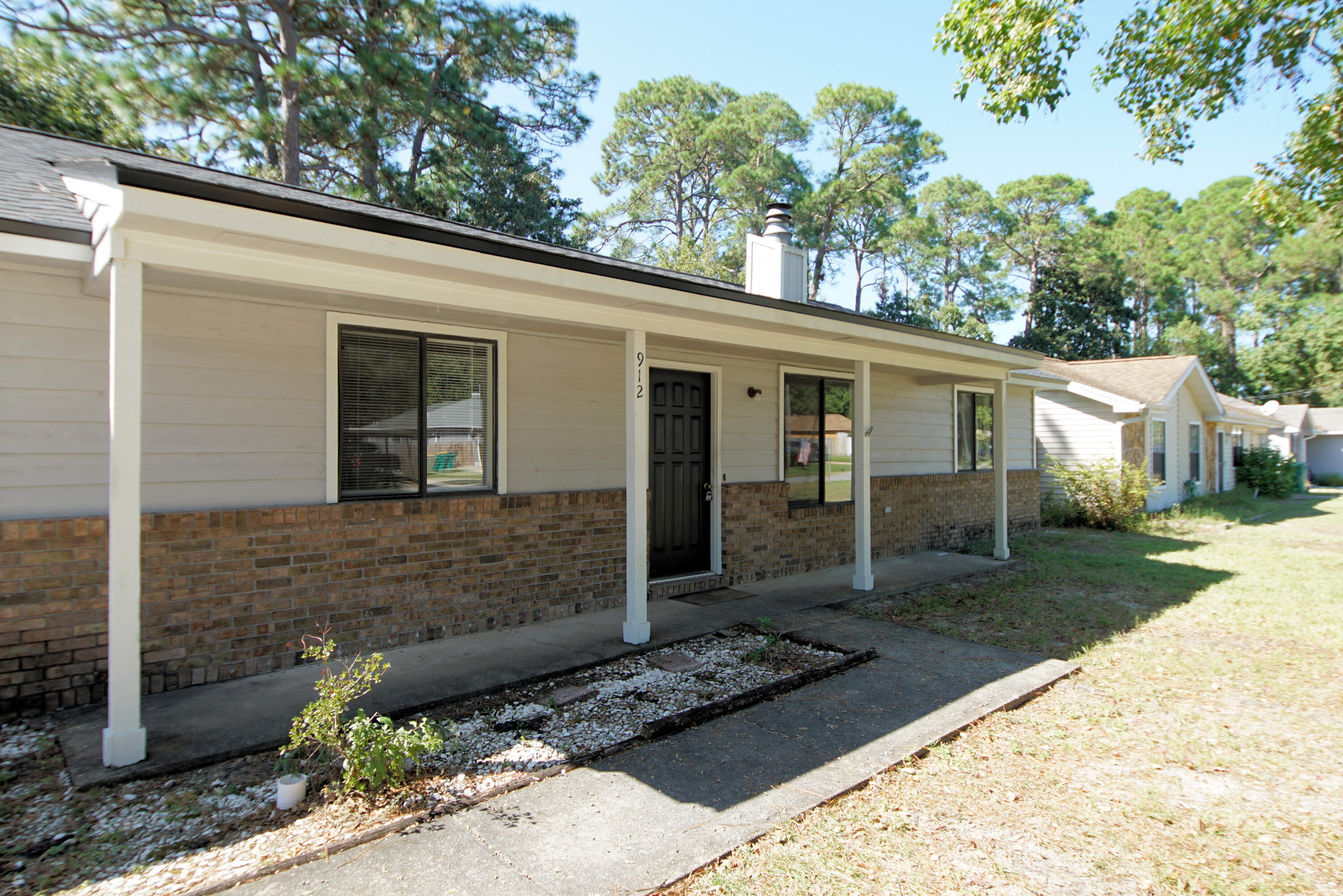 912 Nutmeg Avenue Niceville, FL 32578 - Photo 3 of 30 a view of a entrance gate of the house