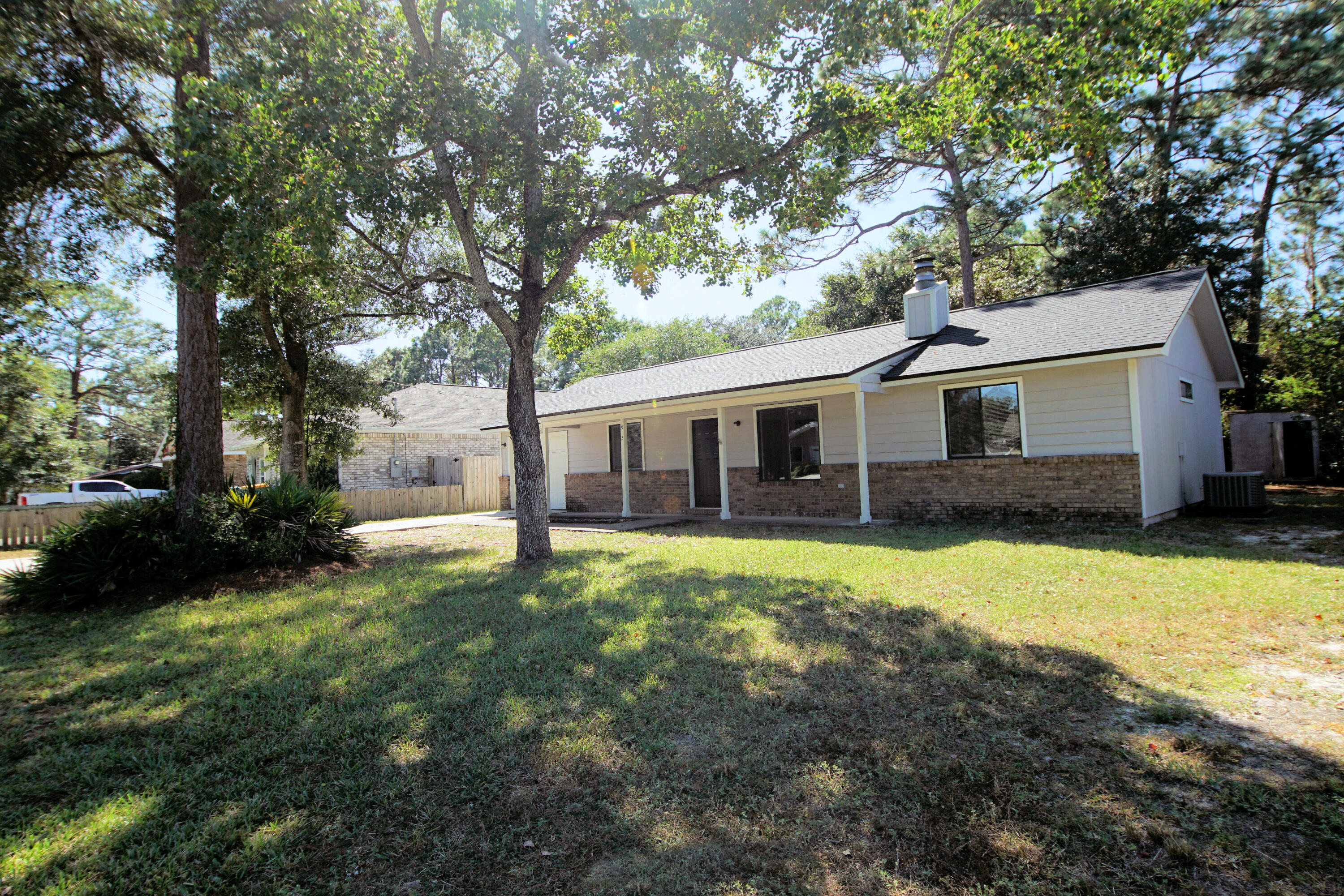 912 Nutmeg Avenue Niceville, FL 32578 - Photo 4 of 30 a view of a house with backyard and garden